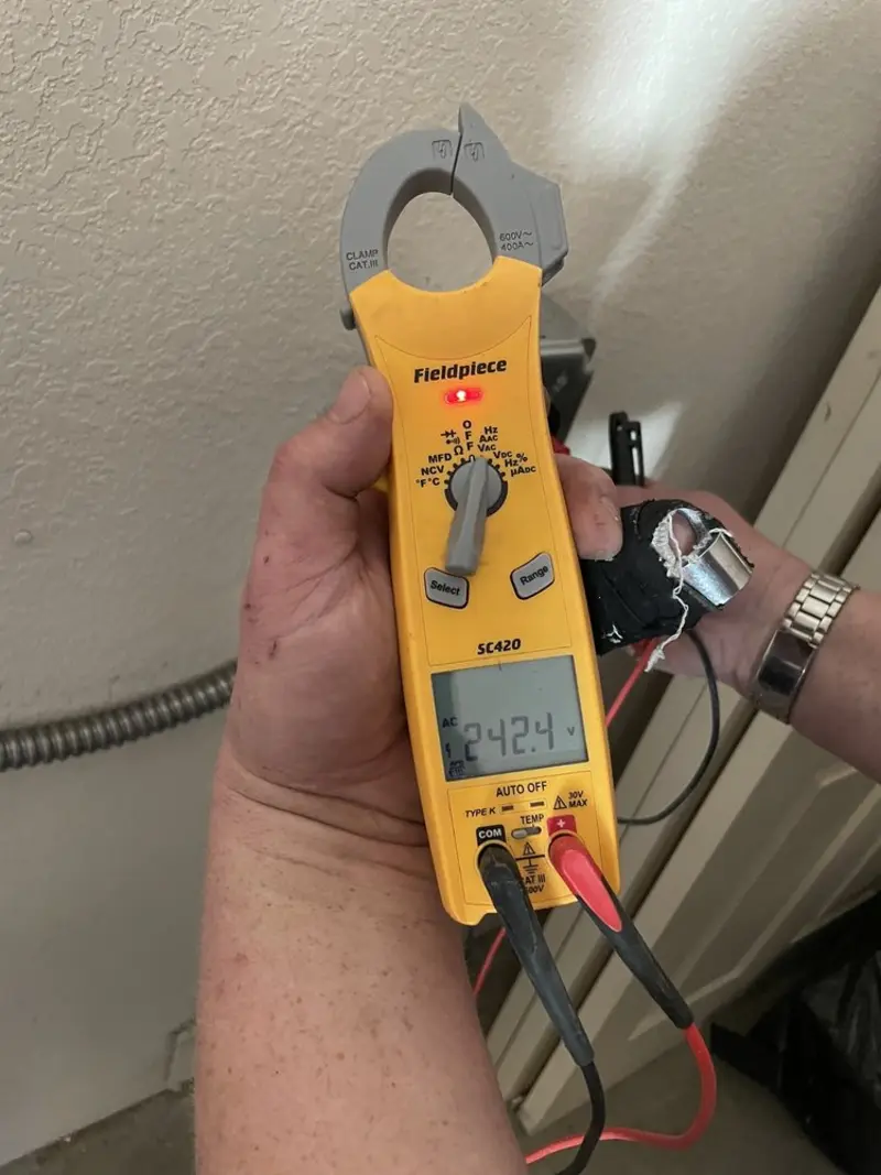 Voltage testing with clamp meter during Outlet Installation in Fallston
